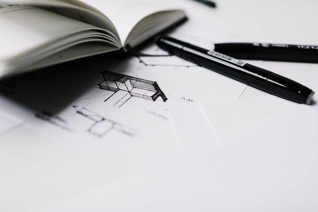 Detailed architectural pencil sketch showing building perspective and shading