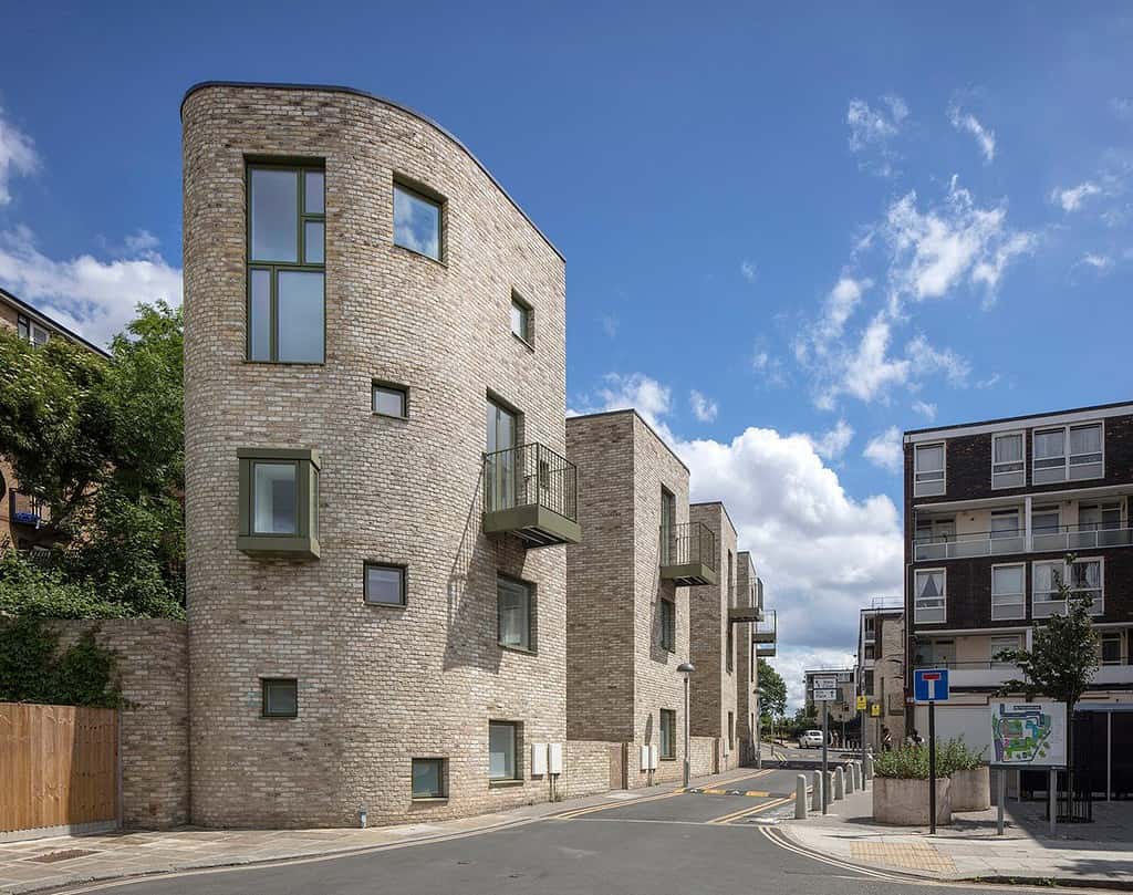 Kiln Place residential architecture featuring distinctive angular projecting balconies and textured brickwork facade