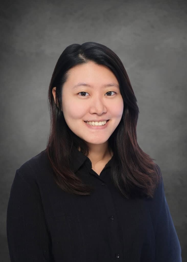 Professional headshot of female Asian architect smiling