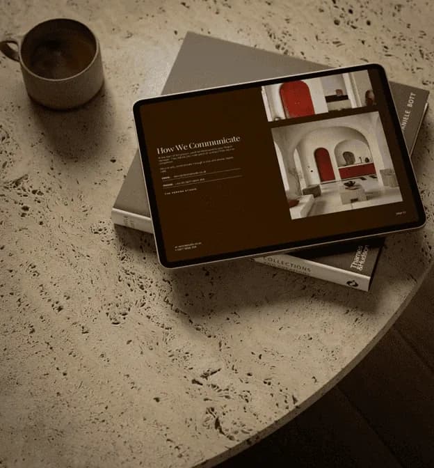 Laptop displaying ArchAdemia course interface with architectural content