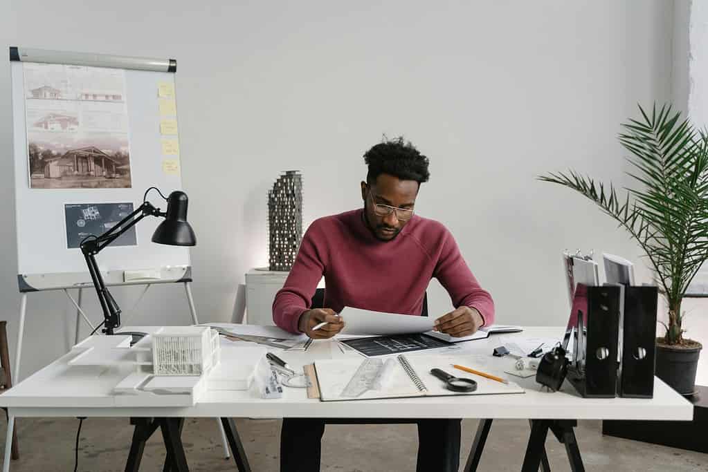 Designer focused on detailed work at professional desk